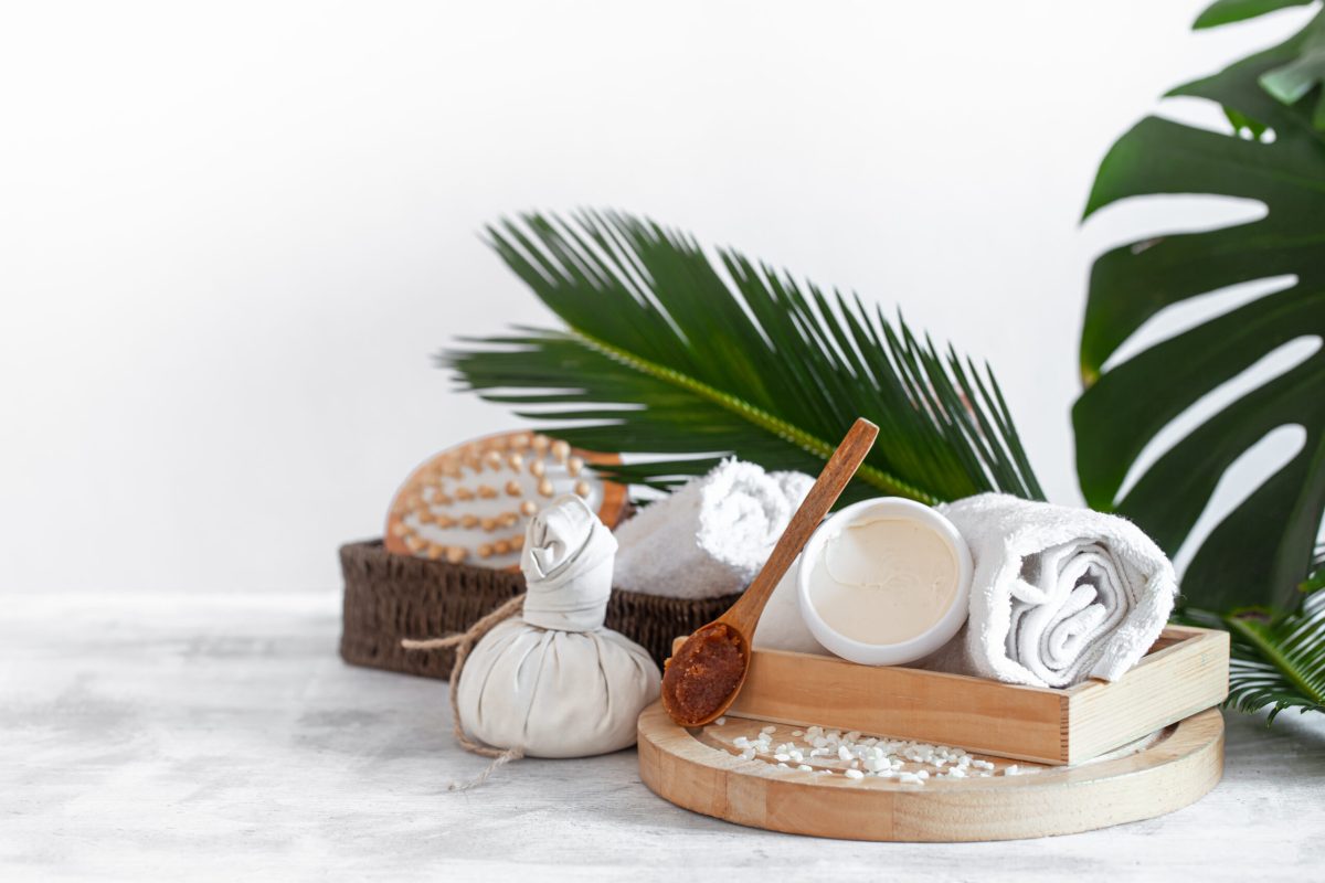 Spa composition with body care items on a light background . A place for text, a concept of beauty and body care .