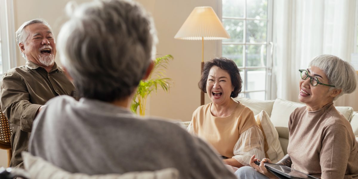 old senior asian friends retired people hapiness positive laugh smile conversation together at living room at nursing home Seniors participating in Group Activities in Adult Daycare Center